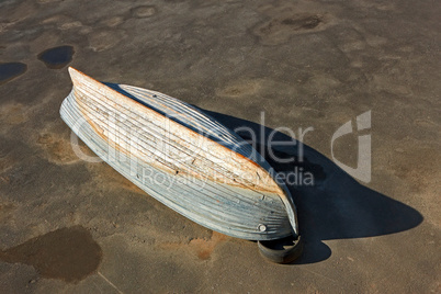 Wooden boat inverted bottom up