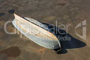 Wooden boat inverted bottom up