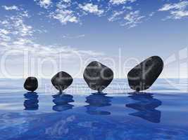 Black stones on blue water 2