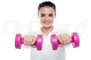 Image of young girl posing with dumbbells