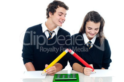 School boy copying from his fellow student