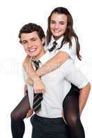 Cheerful shot of youngster riding piggyback