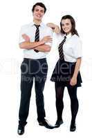 School girl resting hand on her classmates shoulder