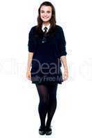 Full length portrait of pretty girl in school uniform