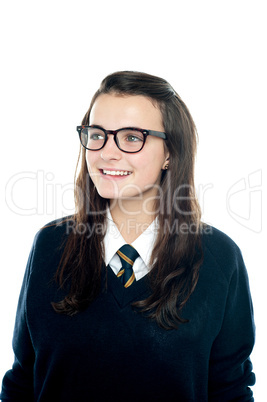Portrait of smiling young schoolgirl looking away
