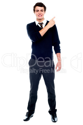 Full length portrait of teenager pointing away