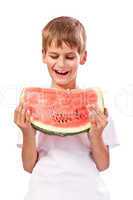 Boy is eating a watermelon