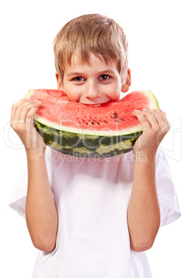 Boy is eating a watermelon