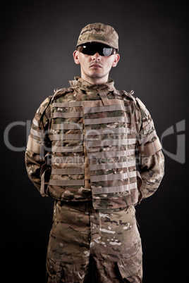 Military man on a black background