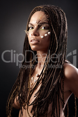 Portrait of a naked african american woman with dreadlocks