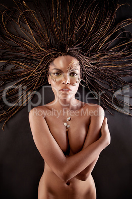 Portrait of a naked african american woman with dreadlocks