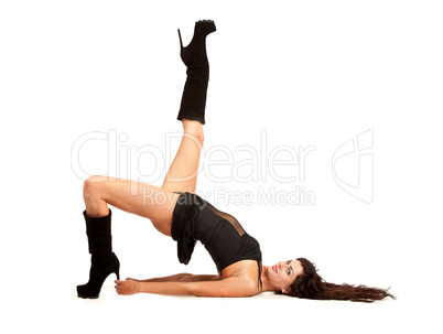 Sexy woman practicing yoga. Wears beautiful boots
