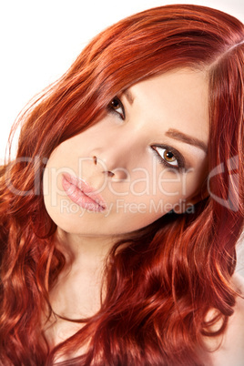 Portrait of young woman with red hair