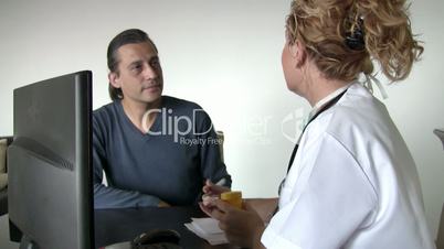 Female doctor consulting with  patient
