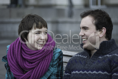 Laughing young couple enjoying winter weather