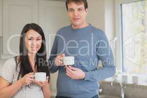 Two people drinking coffee