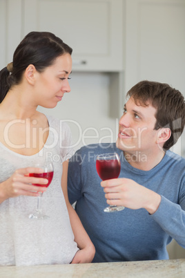 Happy couple with red wine