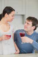 Happy couple with red wine