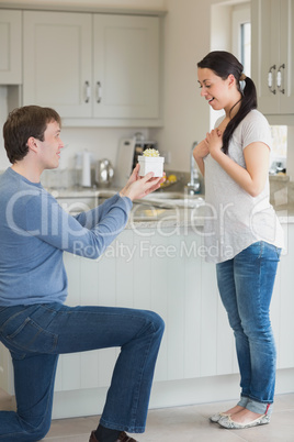 Husband presenting wife with gift