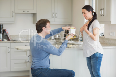 Woman getting a present from husband