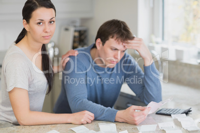 Young couple calculating the finances