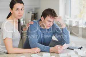 Young couple calculating the finances