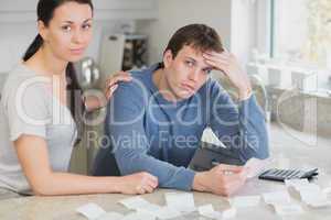 Couple getting stressed over bills