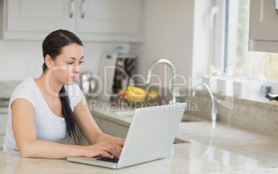 Woman sitting in the kitchen