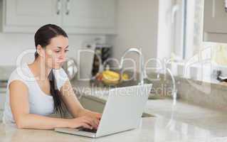 Woman sitting in the kitchen