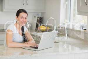 Happy woman working on laptop