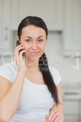 Woman calling in the kitchen