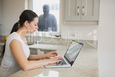 Burglar observing young woman