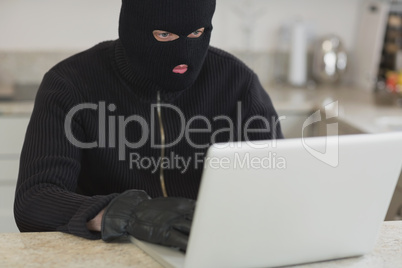 Man hacking an unknown laptop
