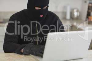 Man hacking an unknown laptop