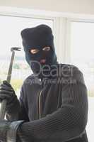 Robber holding a crowbar