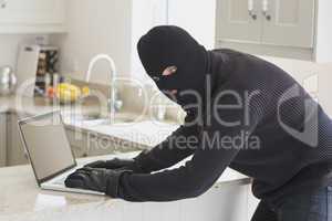 Robber at laptop