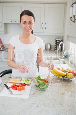 Young woman making healthy lunch