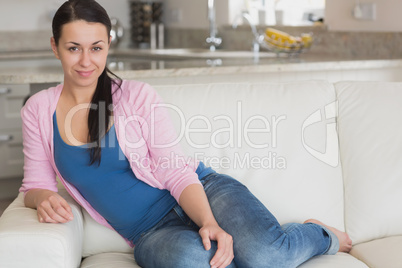 Young woman sitting on the couch