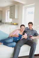 Young relaxing couple in the living room