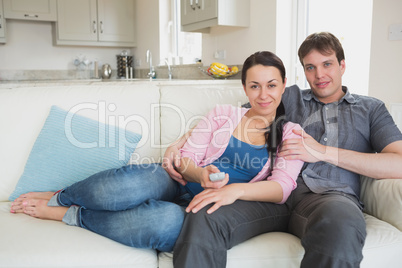 Two people relaxing in the living room