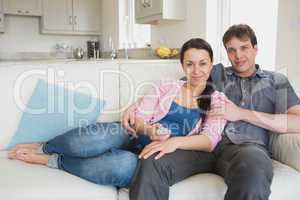 Two people relaxing in the living room