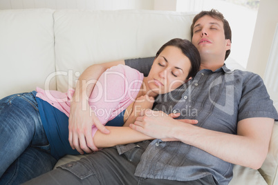 Young couple sleeping on the couch