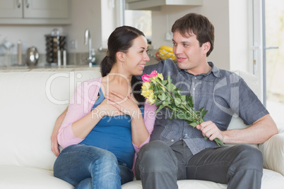 Man giving woman flowers