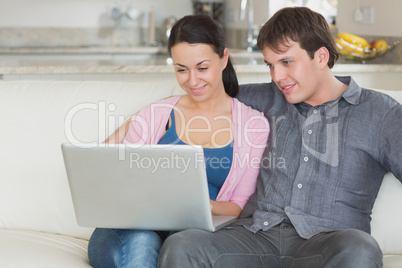 Young couple using the laptop