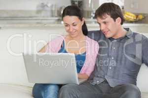 Young couple using the laptop