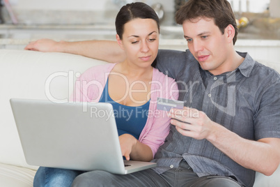 Young couple working on the laptop