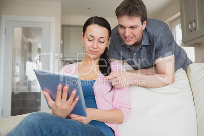 Young couple working on a tablet computer