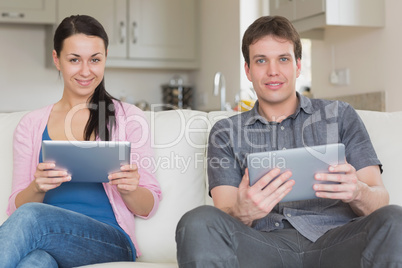 Two friends using a tablet computer