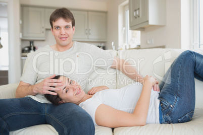 Prospective parents lying on the couch