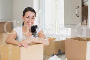 Happy woman unpacking
